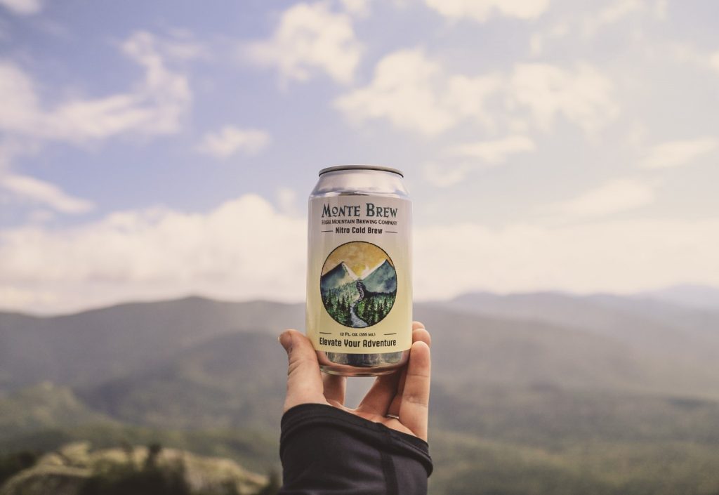 Monte Alto Nitro Cold Brew can in front of the White Mountains